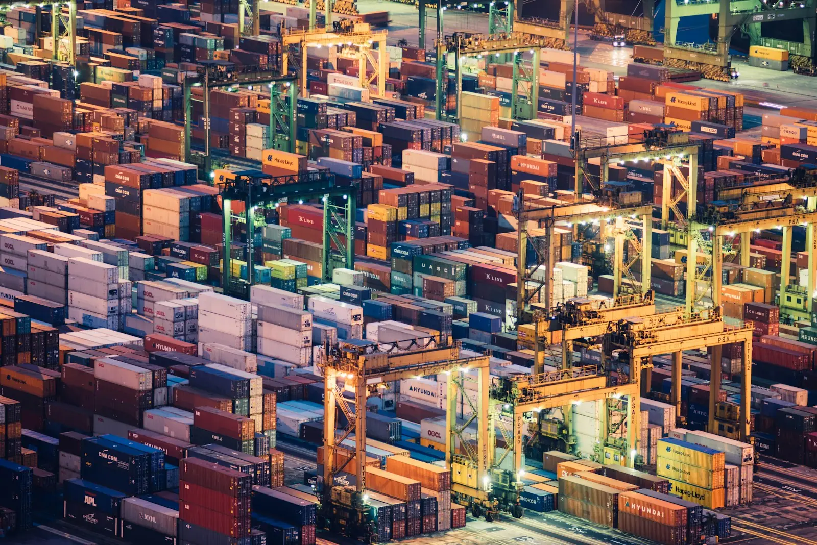 Aerial view of stacked shipping containers in a port